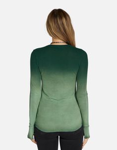 Made in LA 95% Siro Viscose 5% Spandex Wash Cold, Lay Flat to Dry ML Signature Soft Rib Knit Fabric Thumbhole Cutouts Fitted Silhouette Reactive Dye Stretch Fit Model & Fit Info Modeled in Size S Fitted Tee, Size Up If Unsure Height: 5' 9" / Waist: 23" / Bust: 31" / Hip: 34" Stretch V-neck Tops With Thumbholes, Green Fitted Long Sleeve T-shirt, Trendy Tops With Thumbholes For Loungewear, Green Stretch Long Sleeve Knit Top, Fitted Tops With Thumbholes For Loungewear, Fitted Loungewear Tops With Thumbholes, Green Stretch T-shirt For Fall, Green Fitted Crew Neck Top, Fitted Green Crew Neck Top