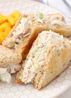 a white plate topped with sandwiches and chips