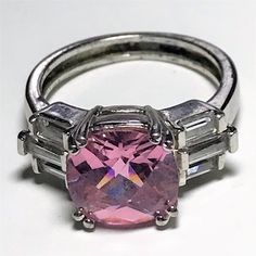 Stunning pink square checkerboard facets gemstone ring. sets of 3 baguette stones on each side of the gorgeous pink citrine. domed shape with lots of marvelous facets. great birthstone ring for October thanks for looking very good condition, signed NV for Nevada Silversmiths. Not tested or marked for silver. size 7 1/2 thanks for looking free shipping to US d7r PayPal preferred Please visit my other vintage sites vintagenecklaces715.etsy.com vintagebooks715.etsy.com vintageearrings715.etsy.com v Pink Square Cut Gemstone Jewelry, Pink Rectangular Ring With Accent Stones, Pink Baguette Cut Gemstone Ring, Pink Faceted Jewelry For Anniversary, Pink Rectangular Stone Ring For Anniversary, Modern Pink Jewelry For Anniversary, Pink Faceted Ring Jewelry, Pink Baguette Cut Jewelry With Center Stone, Pink Jewelry With Center Stone And Baguette Cut