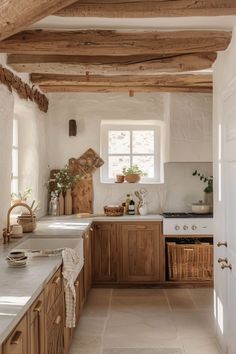 a kitchen with wooden cabinets and white counter tops in an old farmhouse style house or home