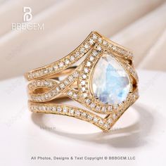 an image of a ring with diamonds on the bottom and a blue stone in the middle