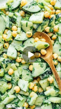 cucumber and chickpea salad with a wooden spoon