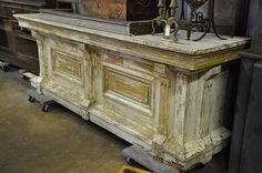 an old wooden counter in a shop