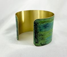 These unique, hand-formed copper and brass cuff bracelets with vibrant patinas create stunning accents to your personal style. Dress up or down- either way you'll be wearing an adornment that will turn heads, start conversations, and delight the eye of the beholder. This is a customizable brass or copper cuff with a beautiful green/blue marbled Tiffany patina. Tiffany has incredible variety of color, sometimes more green, sometimes more teal- and looks different depending on the metal, base pati Brass Cuff Bracelet, Patina Color, Eye Of The Beholder, Brass Cuff, Copper Cuff, Fabric Tape, Copper And Brass, How To Make Notes, The Eye