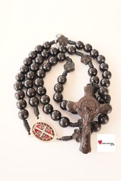 A beautiful black wood rosary makes a meaningful and beautiful gift for a first communion, or confirmation. Also perfect gift for a father or husband. Devoted to St Benedict with wood crucifix, accented with flower shaped beads. A nice piece to accent your spiritual life, or the life of a loved one! Specifications: Length: 20 in beads -  8 mm God Bless you! Note: The colors of the rosary may vary slightly from the photo Rosary Gift, San Jacinto, Orange Agate, St Benedict, The Rosary, Communion Gifts, Rosary Catholic, Catholic Gifts, Wood Carved