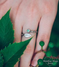 This unusual open ring is an intricately engraved silver tree branch with a shining round emerald and a small leaf. Fairytale princesses look great with a nature ring. Leaf Fairy, Ring With Emerald, Twig Ring, Nature Ring, Silver Tree, Wrap Ring, Small Leaf, Silver Engraving, Wrap Rings