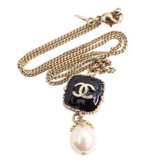 Authentic Chanel black enamel and pearl in yellow gold necklace. Featuring a Chanel logo pendant with dangle pearl. This necklace is absolutely gorgeous. The chain has a lobster clasp with a Chanel tag. Marked 08A Made in France Chain measures 17" Classic Black Jewelry With Logo Charm, Elegant Black Jewelry With Logo Charm, Vintage Necklace With Logo Charm For Formal Occasions, Luxury Pearl Chain Dangle Jewelry, Classic Formal Jewelry With Logo Charm, Luxury Formal Necklace With Logo Charm, Luxury Formal Pearl Necklace With Chain, Luxury Black Necklace With Logo Charm, Luxury Necklace With Logo Charm For Formal Occasions