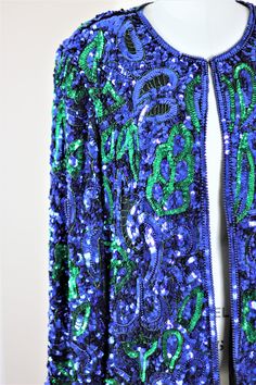 "Isnt this a beauty??? sooo colorful and so beautiful and in Excellent condition..beads, sequins, this jacket has it all!! sparkles..and it is heavy too!! Measuring: 29\" length Width: 46\" Sleeves: 23\" Pet Free/smokefree Enjoy!" Blue Embellished Party Outerwear, Party Blue Embroidered Outerwear, Party Embroidered Blue Outerwear, Blue Embroidered Party Outerwear, Blue Embroidered Outerwear For Party, Party Blue Sequined Outerwear, Blue Sequined Outerwear For Party, Beaded Jacket, Green Sequins