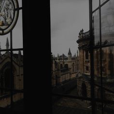 an old building is seen through the window