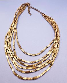 Very beautiful vintage multi strand goldtoned necklace by Chico's! Gold Double Strand Chain Necklace With Beads, Double Strand Gold Chain Necklace With Beads, Elegant Multi-strand Chain Necklace With Gold Beads, Adjustable Gold Multi-strand Layered Necklace, Multi-strand Gold Beads Costume Jewelry, Multi-strand Gold Beaded Necklaces For Jewelry Making, Multi-strand Gold Beaded Necklace For Jewelry Making, Elegant Multi-strand Brass Jewelry, Multi-strand Yellow Gold Metal Jewelry