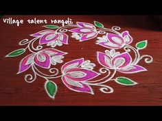 a wooden table topped with a pink and green flower design on top of white doily