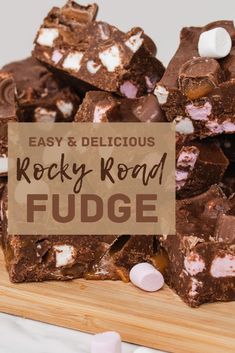 rocky road fudge recipe with marshmallows and chocolate on a cutting board