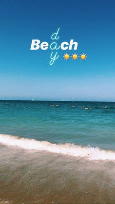 a beach with people swimming in the ocean