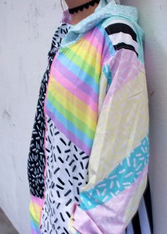 The Concept part of the SOPHOMORIC collection, this new windbreaker is a real show stopper. featuring bold bright rainbow stripes, memphis group inspired prints, grids, stripes, and everything nice...all pastel/bright color enthusiasts as well as lovers of bright alternative fashions like fairy kei or decora are sure to love this windbreaker! Details this windbreaker is made out of a soft, slick polyester that lightly repels water and adds an extra light layer of warmth for breezy fall and sprin 90s Inspired Multicolor Long Sleeve Outerwear, Multicolor Graphic Print Outerwear For Summer, Multicolor Graphic Print Summer Outerwear, Retro Colorful Spring Outerwear, Colorful Retro Spring Outerwear, 90s Multicolor Spring Outerwear, 90s Style Multicolor Spring Outerwear, Retro Multicolor Summer Outerwear, Memphis Group