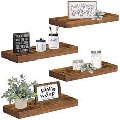 three wooden shelves with signs and plants on them, one has a sign that says soap and water