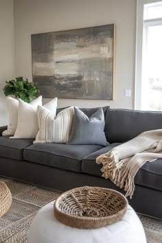 a living room filled with furniture and pillows