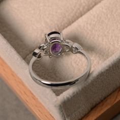 a close up of a ring in a box