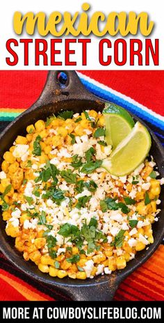 mexican street corn in a cast iron skillet with cilantro and lime