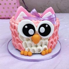 a cake with an owl decoration on it