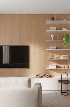 a modern living room with white furniture and wooden wall shelving, including a large flat screen tv