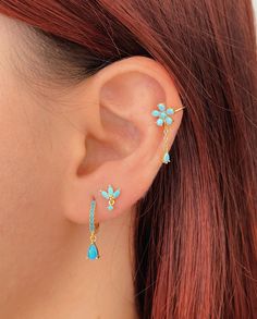 Turquoise earrings, huggie hoop earrings, lotus flower stud earrings, drop earrings, gift for women. Turquoise is a sacred and heavenly color, associated with purity, some believe it repels negative energies and attracts pure and constructive energies for the enjoyment of life. We have designed these two earrings with stunning turquoise cubic zirconias that together make a delicate, aesthetic, and very chic earring set. Design 1: Lotus Flower. It has 3 marquise-cut cubic zirconias in the shape o Piercing Chain, Delicate Aesthetic, Flower Ear Cuffs, Piercings Ideas, Earring Cuff, Surf Jewelry, Helix Earring, Chain Earring, Cowgirl Jewelry