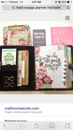 an open planner book sitting on top of a desk next to some pens and pencils