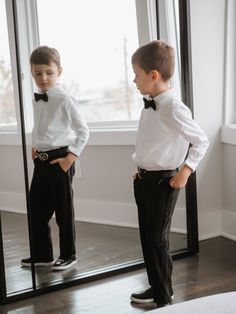 This two-piece set is perfect for special occasions. It includes a crisp white button-down shirt and black tuxedo-style pants that are comfortable and stylish. The easy-care fabric ensures that your boy will look his best all night. Cotton button-down shirt and tuxedo pants set. Shirt has white satin inserts. Pants have a velvet tuxedo line and satin trim back pockets. Adjustable waist. Made in Turkey. Pair with Black Velvet Bow Tie Shirt: 92% cotton, 5 % Silk, 3% Lycra Pants: 59% Polyester, 31 Black And White Two Piece, Kid Tuxedo, White Button Shirt, Shirt And Pants Set, Boys Tuxedo, Velvet Tuxedo, Bow Tie Shirt, Velvet Bow Tie, Black Velvet Bow