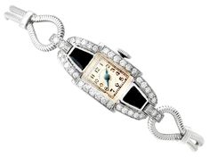 "An impressive vintage Art Deco 0.95 carat diamond and black onyx, platinum cocktail watch by 'Hamilton'; part of our diverse antique jewellery and estate jewelry collections. This impressive vintage Art Deco diamond watch has been crafted in platinum. The watch has a rectangular dial with plain black Arabic hour numerals displayed within rectangular designs, the outer one marked as the chapter ring. The Art Deco watch is fitted with shaped, blued steel hands, and the face clearly displays the t Cocktail Watch, Art Deco Watch, Art Deco Lady, Deco Jewelry, Art Deco Diamond, Women Wrist Watch, Art Deco Jewelry, Diamond Watch, Vintage Diamond