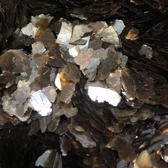 some brown and white rocks are stacked on top of each other in this close up photo