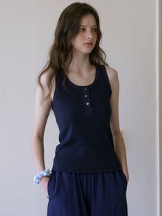 This is a minimal and feminine top by Tillber that is made out of high quality and sturdy material. With distinctive mood of the design and comfortable wear, you can style it for your casual daily outfit.- Deep U neckline- Bamboo fabric ribbing detail- Real sea shell button- Minimal and feminine mood Navy Stretch Cotton Tops, Versatile Cotton Tops With Button Closure, Stretch Tops With Button Closure For Loungewear, Versatile Cotton Tops With Buttons, Stretch Tops With Buttons For Loungewear, Solid Color Tops With Button Closure For Loungewear, Tops With Button Closure For Loungewear, Navy Stretch Top For Workwear, Navy Stretch Tops For Work