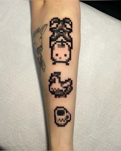 an arm with some pixel tattoos on it