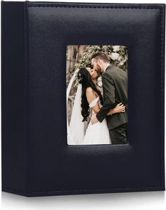 a black leather photo album with an image of a bride and groom