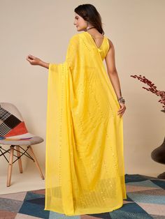 Elevate your wardrobe with our charming yellow sequins georgette haldi wear saree with blouse. This stunning saree is crafted with high-quality georgette material, featuring delicate thread embroidery and sequin work that adds a touch of elegance to the overall look. The vibrant yellow color of the saree is perfect for any festive occasion, especially haldi ceremonies.
The georgette fabric ensures a comfortable and flowy drape, making it easy to move and dance in. The matching art silk blouse co Haldi Wear, Georgette Material, Traditional Saree, Elegant Attire, Haldi Ceremony, Yellow Art, Wear Saree, Georgette Fabric, Traditional Sarees