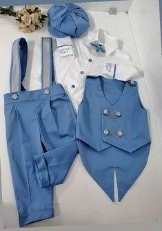 NOTE Please visit my shop for many other kids costumes and custom made outfits.. https://www.etsy.com/shop/SammysCostumes/?etsrc=sdt This Baby Boys Blue 5 Pieces Tuxedo Suit is custom made to order. It comes with Short or Long Pants Boys Shirt, Suspenders, Boys Bow tie, Vest and Free embroidery on arms/cuffs. You can also choose to have date embroidered on one cuff, and name on the other.   Order for 3 6 9 12 months photoshoot with customization for specific month  Order for 1 2 3 4 5 6 7 8 year old birthday photohoot with customization request for specific age  FREE SHIPPING and FREE EMBROIDERY   Matching shoes can be purchased for Age 1 and Age 2 Separately    Newspaper Boys Hat Can be Purchased Separately  NOTE You can order with SHORT or LONG Pants NOTE You can order different ages up One Year Baby Boy Dress, 1 Year Baby Boy Dress, 2 Year Baby Boy Birthday Dress, Customizable Fitted Sets For Baptism, 1 Year Baby Boy Birthday Dress, Birthday Suits For Baby Boy, Baby Boy Dress Suit, Newspaper Boy Hat, 1st Birthday Outfit Boy