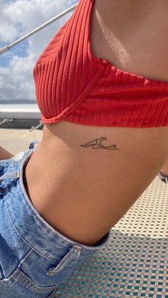 The Art of Travel: Exploring the World of World Traveler Tattoos | Aesthetic & Unique Tattoo Ideas Tiny Body Tattoos, Soul Surfer Tattoo, Be Achy Tattoos, Wave Tattoo Under Bra Line, Henna On Ribs, Cute Line Tattoos Simple, Henna Tatoos Ideas Aesthetic, Beach Inspo Tattoo, Aesthetic Beachy Tattoos