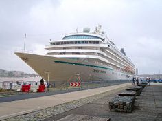 a large cruise ship docked at the dock