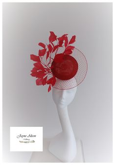 'Make an entrance with this veiled percher style headpiece in deep red.  A sinamay button encases a red veiling disc, whilst cut goose feathers twist and turn as they emerge from the centre.  Sits on a percher headband. This item has sold, however, similar pieces can be made in a variety of colours.  Please ask for details.  As every piece is handmade, some differences can occur from the photos listed on this site.  Made to order/bespoke/custom orders are non-refundable/returnable. Please read o Red Fascinator Hats, Red Fitted Headpieces For Wedding, Red Structured Crown Mini Hat For Kentucky Derby, Red Structured Crown Costume Hat For Wedding, Red Mini Hats With Structured Crown For Kentucky Derby, Red Mini Hat For Kentucky Derby With Structured Crown, Fitted Red Costume Hats For Royal Ascot, Red Mini Hat For Royal Ascot And Formal Occasions, Red Headpieces For Kentucky Derby Evening