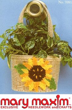 a cross stitch sunflower in a basket with the words mary maxm on it