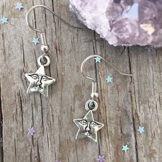 "Cute Star Earrings with Smile Face Star face charm about 1/2\". Star is zinc alloy. Surgical steel ear wires. Your earrings will come in an organza bag to gift or keep for yourself. Bubble wrapped for safe travel. Flat rate shipping no matter how much your order. To view a personalized sun necklace click here: https://www.etsy.com/listing/292929419/sun-initial-birthstone-choker-custom-sun?ref=shop_home_active_3 To view other earrings: https://www.etsy.com/shop/Beadaboutique?ref=ss_profile§ion_i Symbolic Star Shaped Earrings For Gift, Symbolic Star-shaped Nickel-free Earrings, Symbolic Nickel-free Star Earrings, Nickel-free Star Shaped Symbolic Earrings, Moon Charm Star Earrings As Gift, Moon Charm Star Earrings For Gift, Moon Charm Star-shaped Earrings For Gifts, Star-shaped Moon Charm Earrings For Gift, Moon Face Earrings