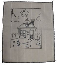 a drawing of a house on a piece of cloth