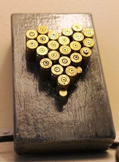 What to do with all those bullet casings the kids find during campouts. Label with the outing date & location. Bullet Casing Heart by Reinspiredme on Etsy, $29.95 Hunting Crafts, Bullet Art, Bullet Shell, Bullet Casing, Bullet Jewelry, Shell Art, Shell Crafts