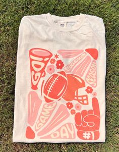 Get this popular NEW touchdown season shirt and show off your team spirit in style!  Each shirt is printed in-house by me using high-quality materials on a Comfort Colors shirt, known for its exceptional comfort, style, and durability. Available in unisex sizes S to 3X, and youth sizes, we've got you covered regardless of your preferred fit. This football game day shirt features a classic crew neck and short sleeves, making it suitable for year-round wear. The flattering silhouette ensures a com Cheap School Spirit Shirt For Game Day, College Tshirt Designs Shirt Ideas, Athletic T Shirt Design, Collegiate T-shirt With Custom Print For Game Day, School Spirit Shirt With Graphic Print For Fans, Collegiate Graphic Print Shirt For Game Day, Team Spirit Graphic Print Shirt For Game Day, Game Day Graphic Print Shirt For Sports Season, Football Season Graphic Print Shirt Fan Apparel