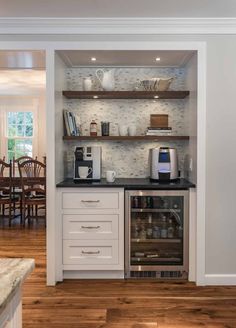 the instagram page shows an image of a kitchen with white cabinets and open shelves