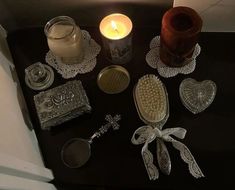 a table topped with lots of different types of items on top of a black surface