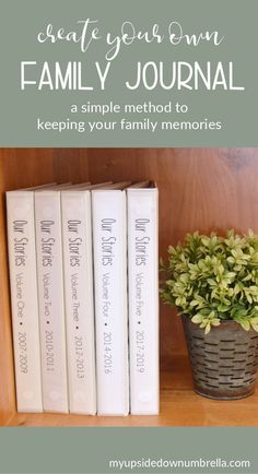 three books sitting on top of a wooden shelf next to a potted plant