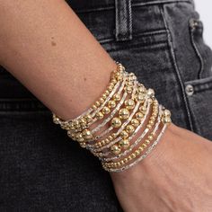 Handmade in Brazil, the Bianca Wrap Bracelet will amplify any casual outfit you have on. This stunning statement piece is Brazilian gold filled featuring a fabulous multi wrap design with small and large gold beads. Brazilian Gold Filled 2.5" diameter Hypoallergenic Water & Tarnish Resistant Gold Stackable Wrap Bracelet, Gold Hand Wrapped Beaded Bracelets For Party, Gold Hand-wrapped Beaded Bracelets For Party, Gold Hand Wrapped Bracelet, Gold Hand Wrapped Bracelets For Party, Hand Wrapped Gold Bracelets For Party, Brazilian Gold, Sunglass Chain, Jewelry Studio