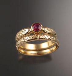 "This pretty ring set has a Victorian antique look with a 4mm round natural Orange Sapphire from Ceylon. Set in 14k Yellow Gold The band is 4mm wide and 1.5mm thick. The matching band is 2.5mm wide and 1.3mm thick The color of these stones ranges from fire orange to pink orange as shown in the last picture. Specify your size and color preference in a \"note to seller\" at check out." Padparadscha Sapphire Ring, Purple Sapphire Ring, Sapphire Wedding Rings, Padparadscha Sapphire, Gold Rings Jewelry, Gold Ring Designs, Sapphire Wedding, Orange Sapphire, Pretty Rings