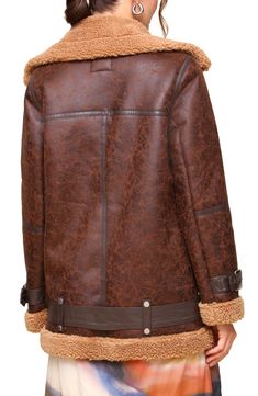 Rev the engines on rugged style with a swaggy biker jacket made from sturdy faux shearling. 29 1/2" length (size Medium) Asymmetric zip closure Notched lapels Belted cuffs Chest zip pocket; front zip pockets Removable belt 100% polyester faux shearling Dry clean Imported Brown Biker Jacket With Zipper For Winter, Rugged Leather Jacket With Zipper For Winter, Distressed Brown Biker Outerwear For Winter, Brown Asymmetrical Zip Biker Jacket For Winter, Brown Biker Jacket With Zipper For Cold Weather, Rugged Brown Biker Jacket For Winter, Brown Leather Jacket With Zipper For Cold Weather, Fall Brown Biker Jacket With Padded Collar, Fall Aviator Leather Jacket For Outdoors