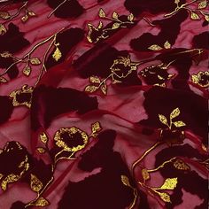 red and gold fabric with flowers on it