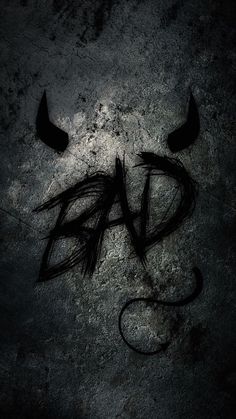 the word dad written in black ink on a concrete surface with two horns sticking out of it